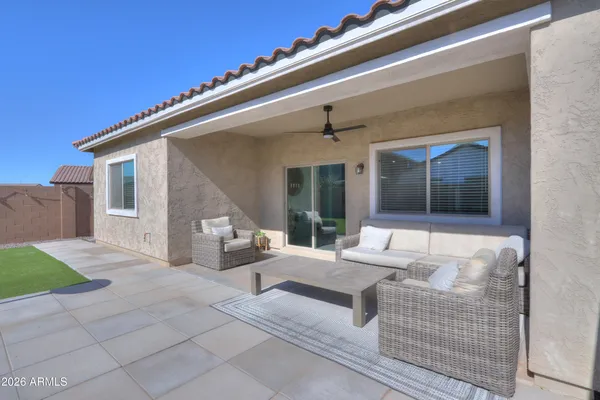 a view of a house with backyard and porch