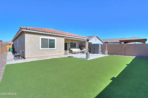 a building outdoor space with patio furniture and potted plants