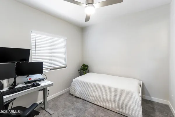 a bedroom with furniture and a window