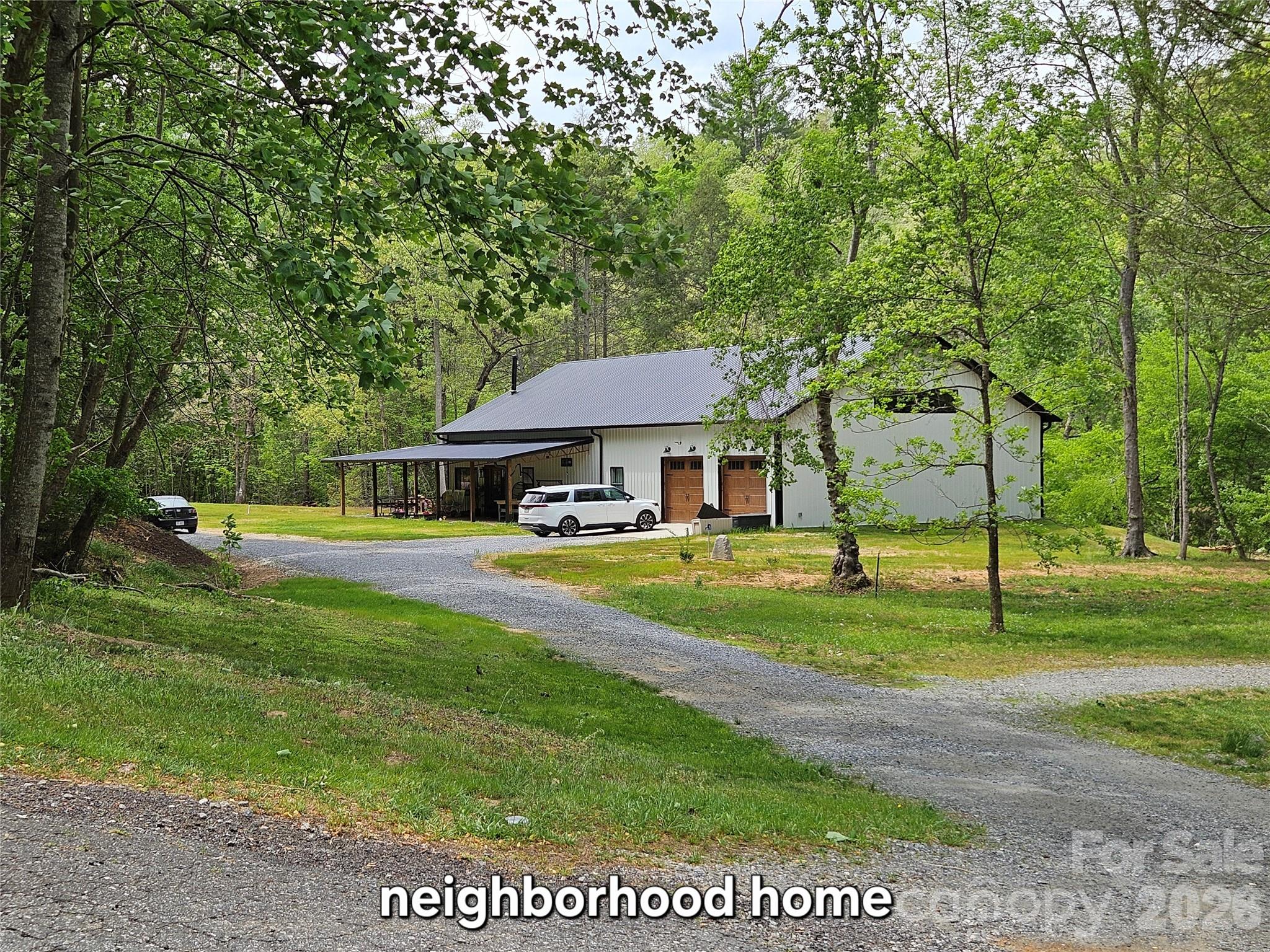 81 North Mill Ridge Nebo, NC 28761 - Photo 43 of 46 a front view of a house with a yard
