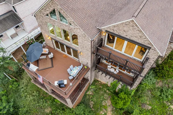 aerial view of a house with roof deck