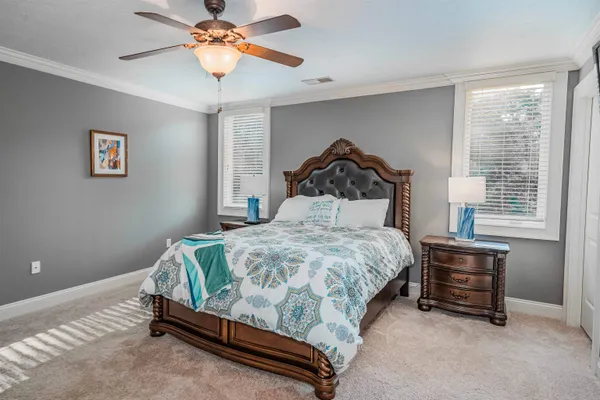 a bathroom with a granite countertop sink toilet a mirror and shower