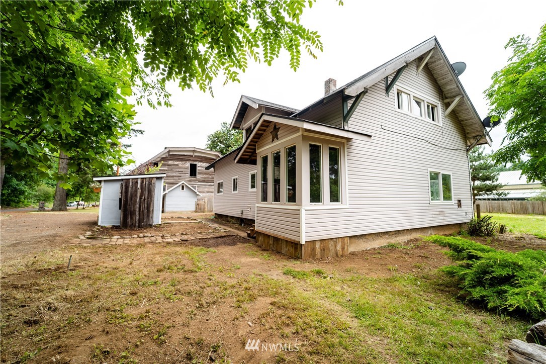 237 Hatchery Road Chehalis, WA 98532 - Photo 2 of 30 a white house that has a tree in front of it