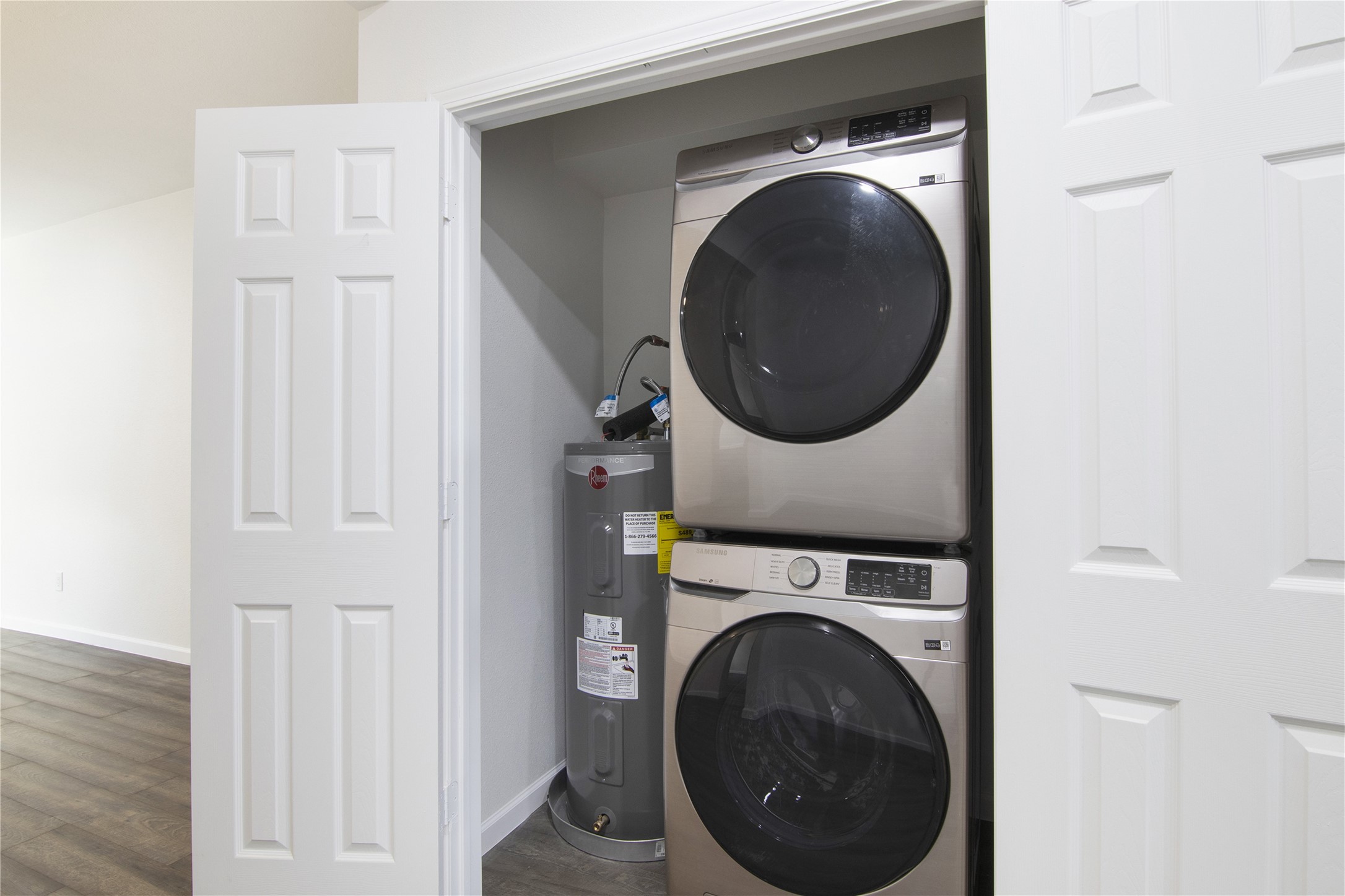 6401 Deihl Road, Unit 606 Houston, TX 77092 - Photo 11 of 21 a view of a hallway with washer and dryer
