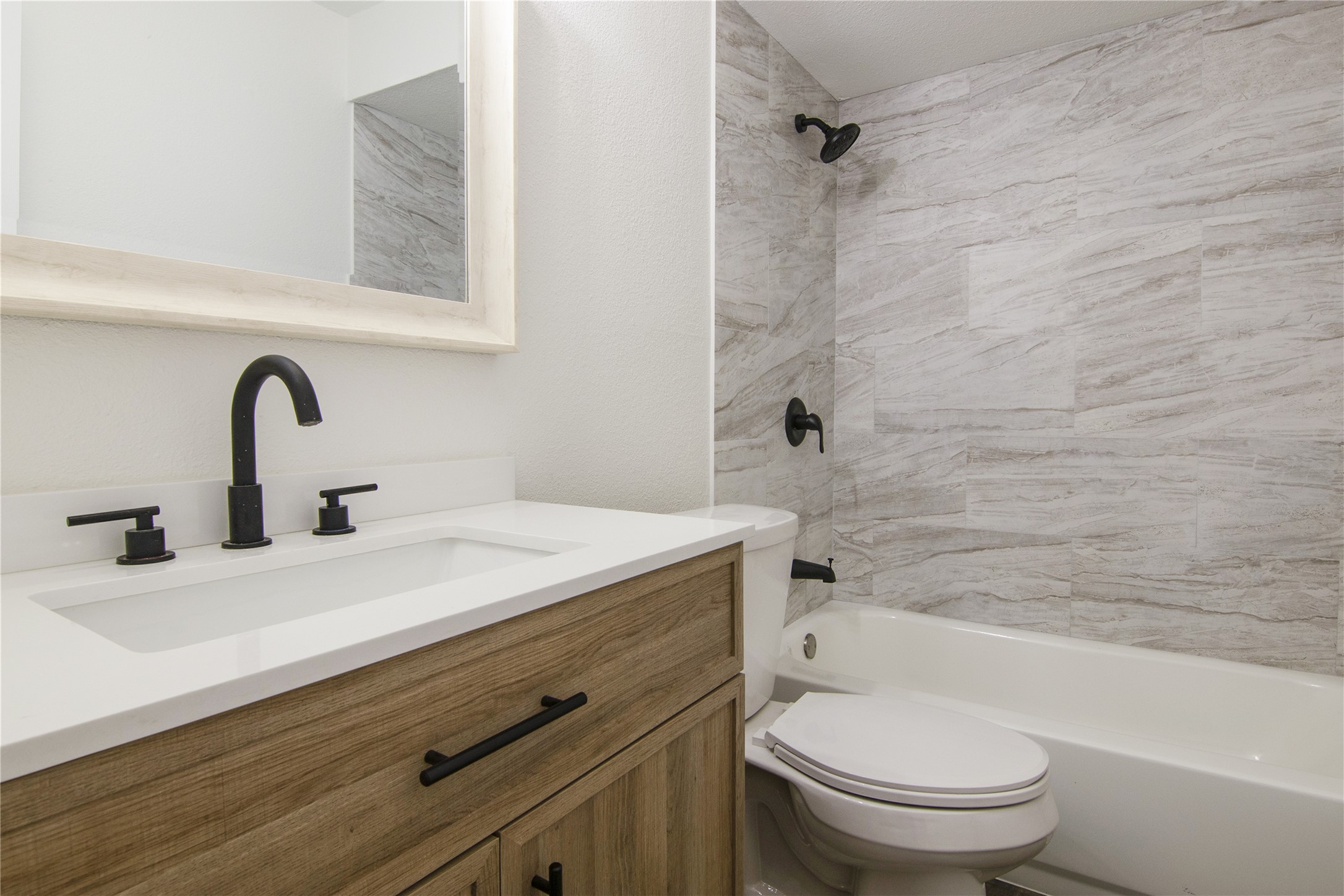 6401 Deihl Road, Unit 606 Houston, TX 77092 - Photo 13 of 21 a bathroom with a sink a toilet and shower