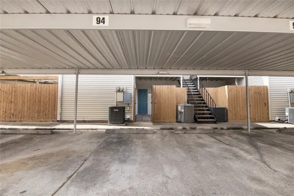 a view of an empty room with stairs