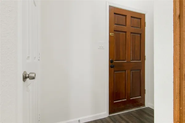 wooden floor and closet in a bathroom