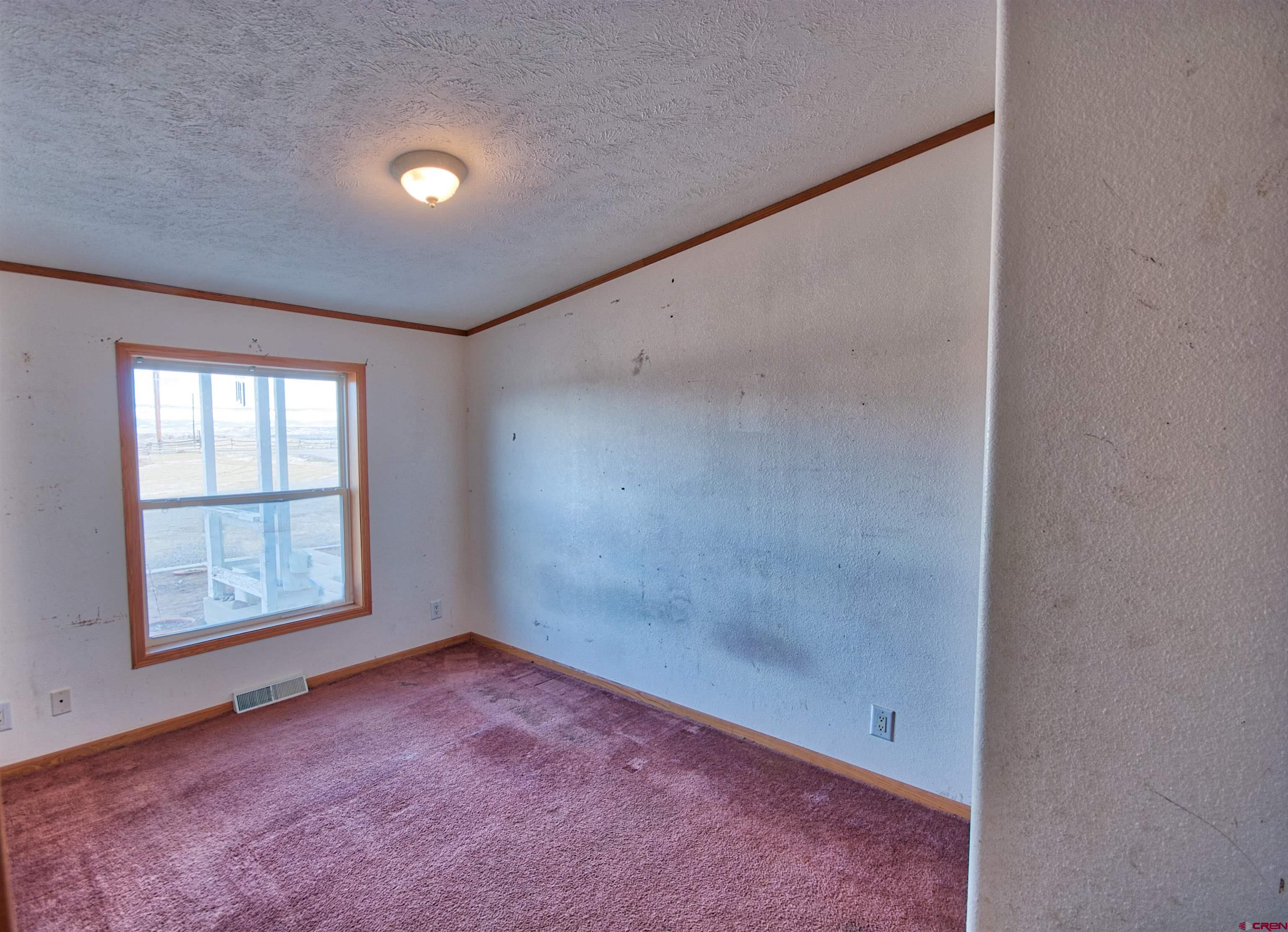 21548 F Road Delta, CO 81416 - Photo 12 of 21 an empty room with windows