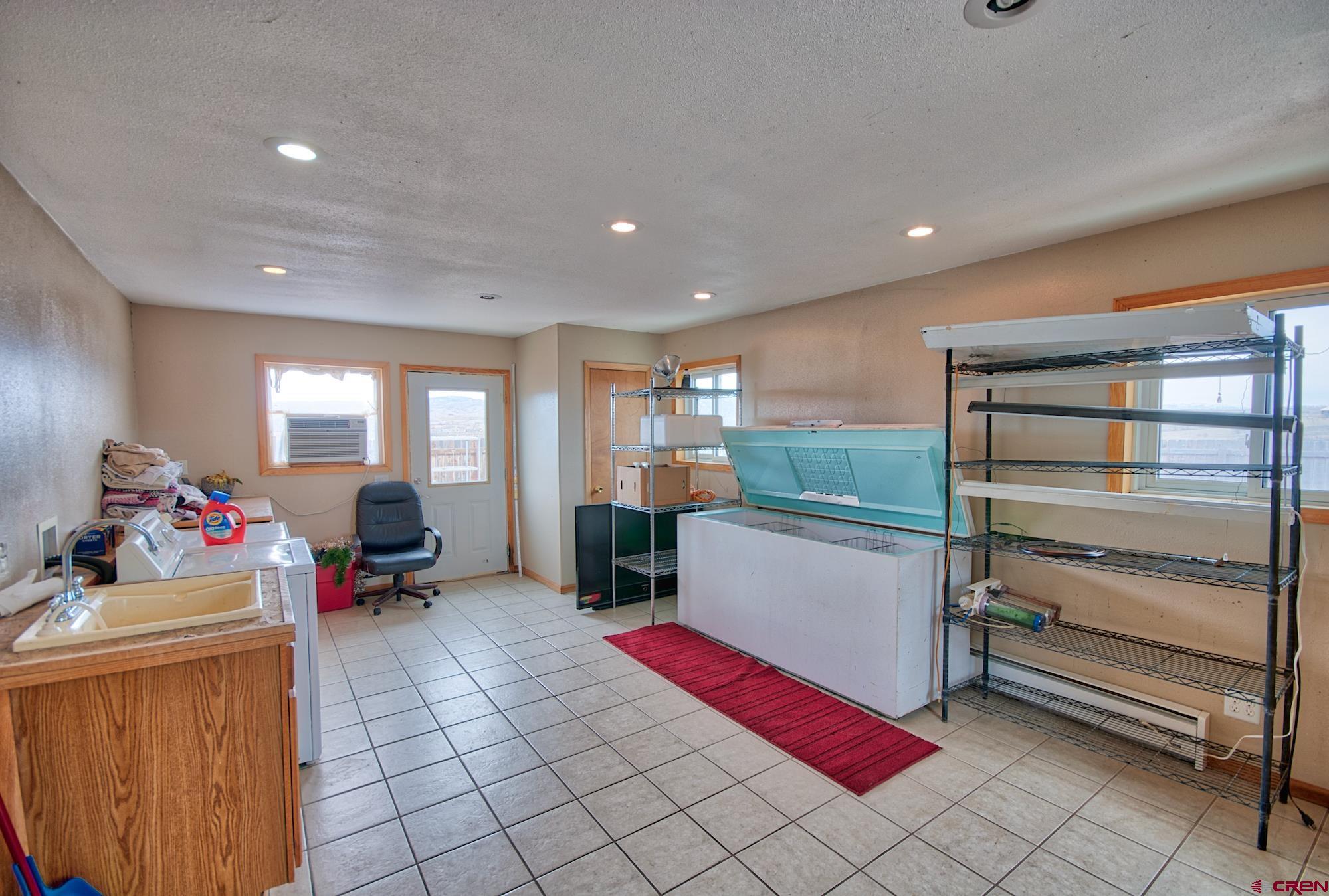 21548 F Road Delta, CO 81416 - Photo 13 of 21 a room with furniture and a wooden floor