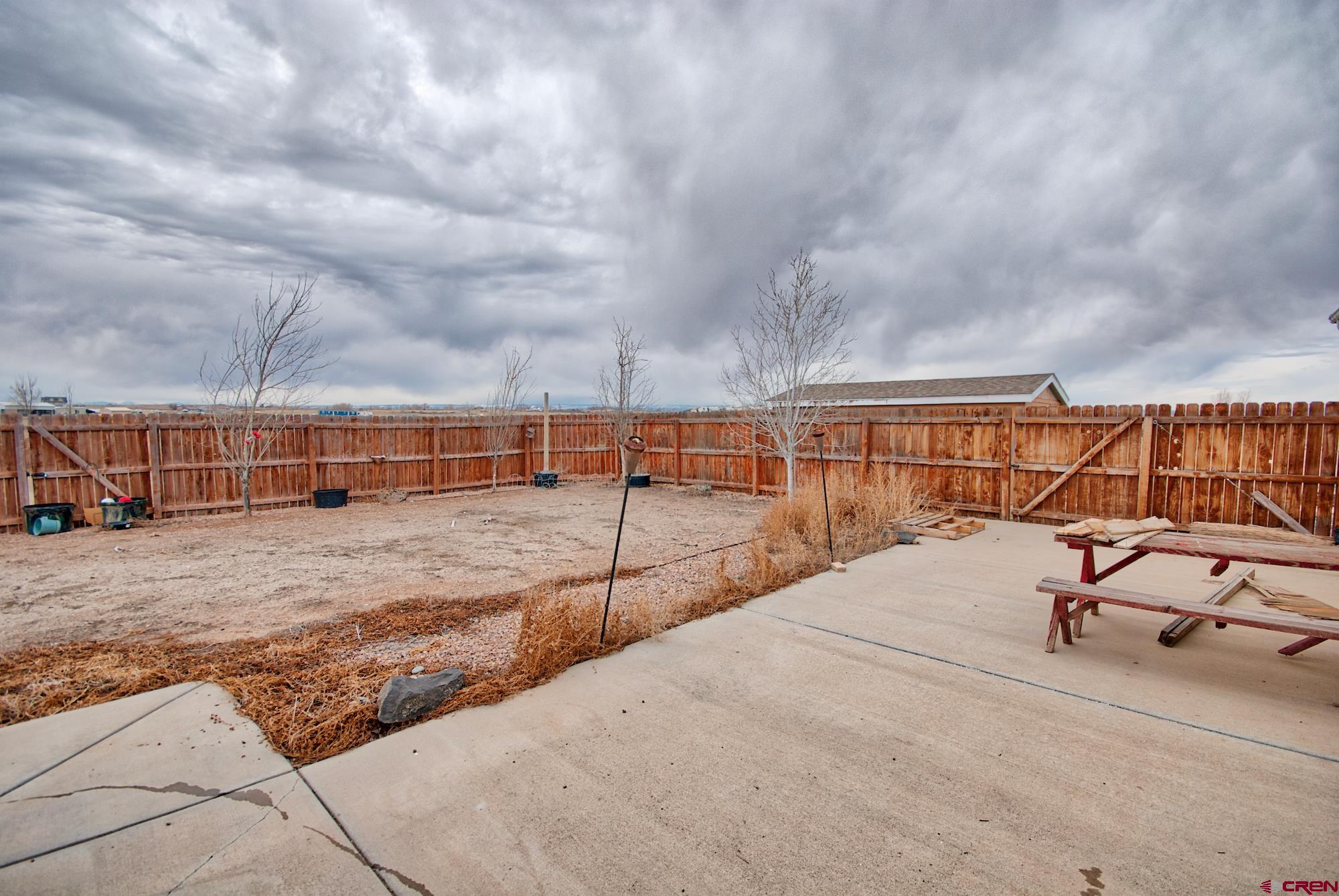 21548 F Road Delta, CO 81416 - Photo 14 of 21 a view of a swimming pool with a lounge chair