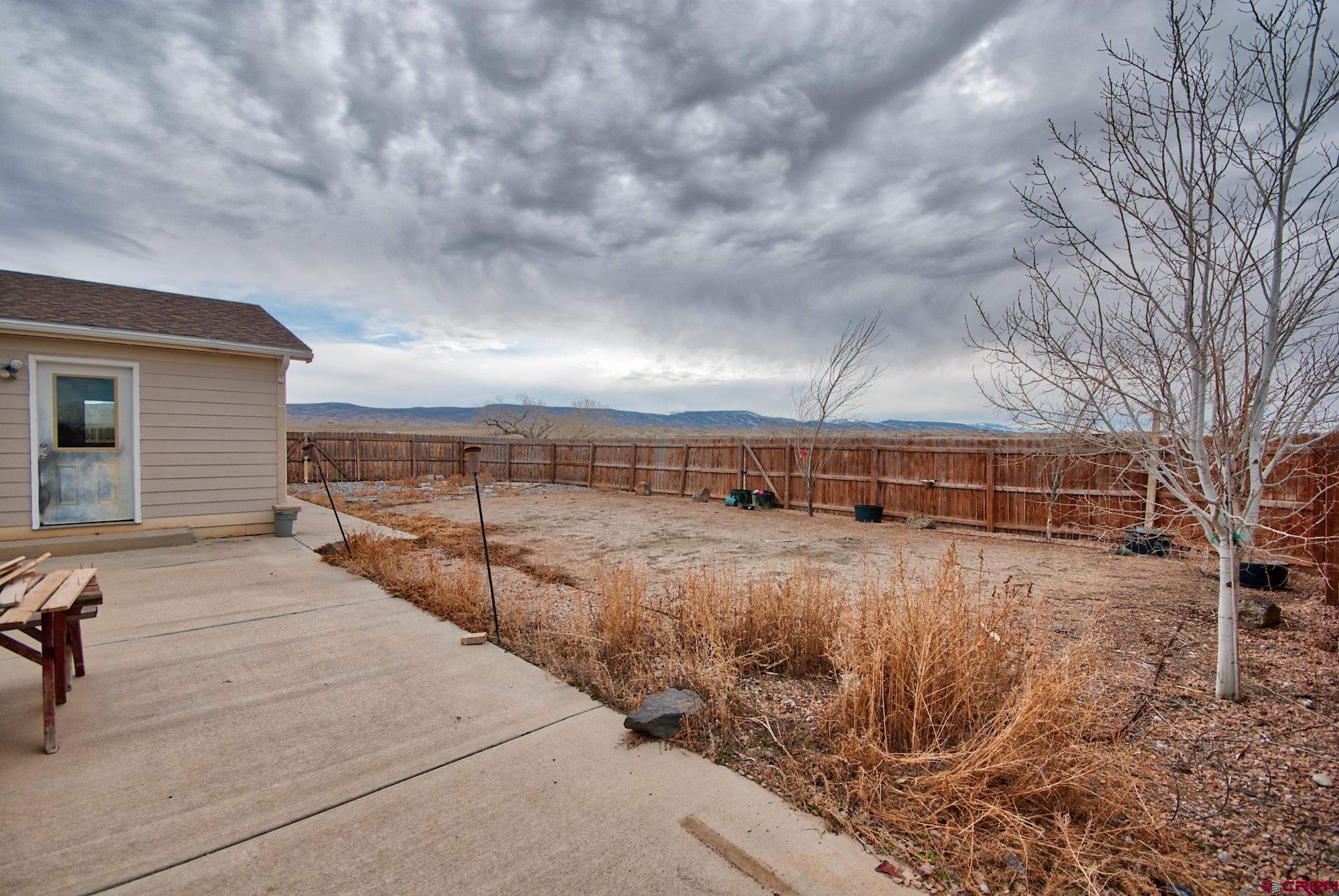 21548 F Road Delta, CO 81416 - Photo 15 of 21 a view of a house with backyard