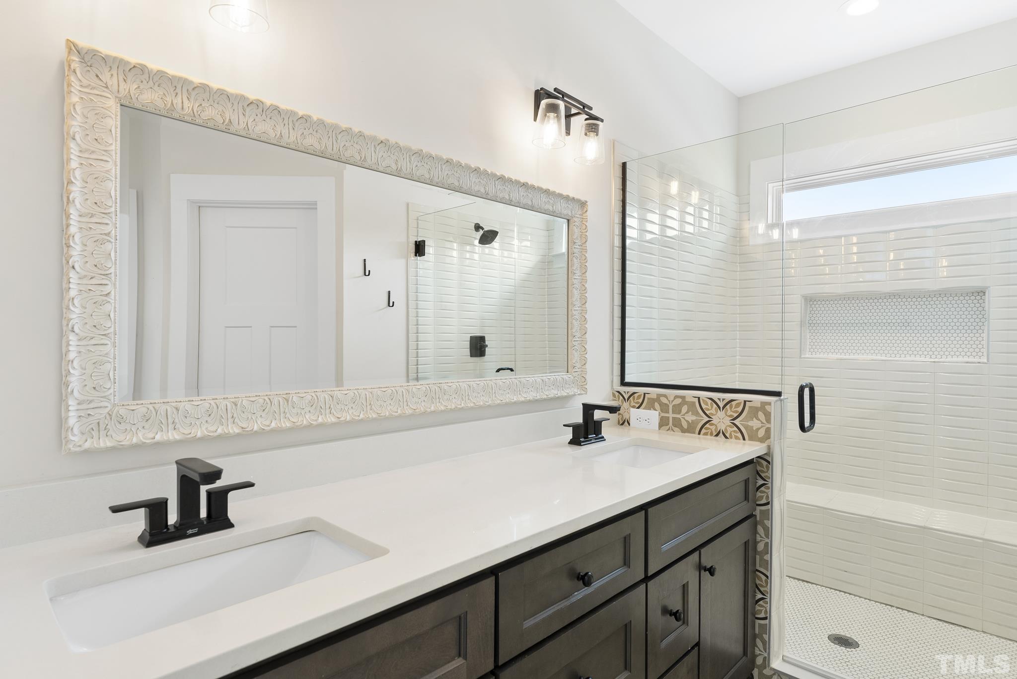 2320 Milburnie Road Raleigh, NC 27610 - Photo 27 of 40 a bathroom with a sink and a mirror