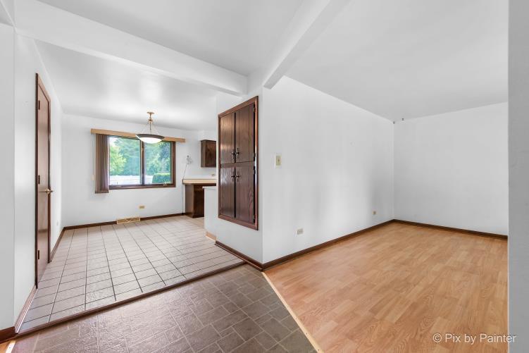 195 Westgate Drive Elgin, IL 60123 - Photo 15 of 39 a view of an empty room with a window and fire place