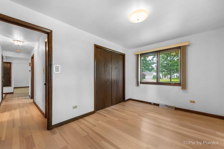 195 Westgate Drive Elgin, IL 60123 - Photo 22 of 39 a view of an empty room with wooden floor and a window
