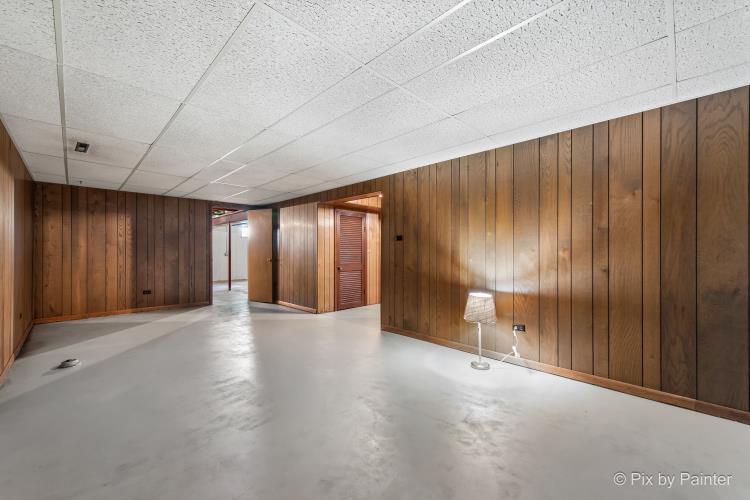 195 Westgate Drive Elgin, IL 60123 - Photo 24 of 39 a view of an empty room with wooden walls