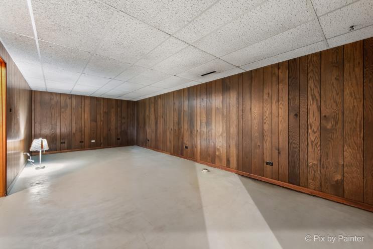 195 Westgate Drive Elgin, IL 60123 - Photo 25 of 39 a view of an empty room with wooden walls