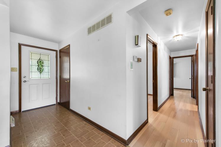 195 Westgate Drive Elgin, IL 60123 - Photo 5 of 39 a view of a hallway with wooden floor