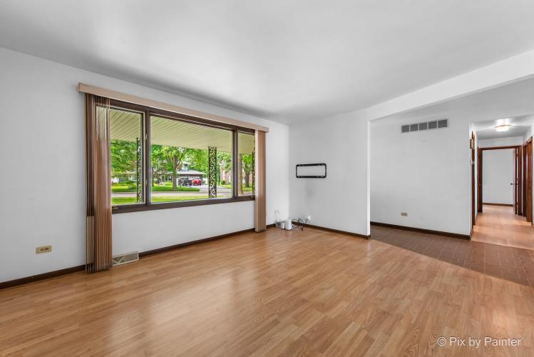 195 Westgate Drive Elgin, IL 60123 - Photo 6 of 39 wooden floor in an empty room with a window
