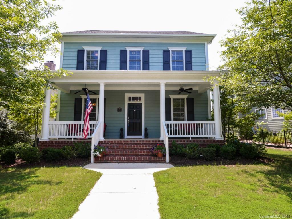 411 Bull Finch Bend Fort Mill, SC 29708 - Photo 1 of 22 a view of a brick house with a yard plants and large tree