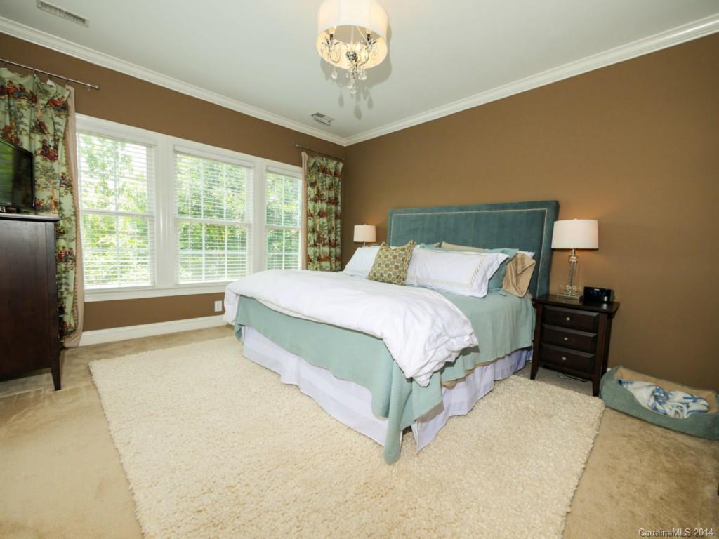 411 Bull Finch Bend Fort Mill, SC 29708 - Photo 11 of 22 a bedroom with a bed and a large window