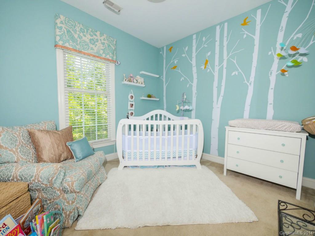 411 Bull Finch Bend Fort Mill, SC 29708 - Photo 14 of 22 a bedroom with a bed and a window