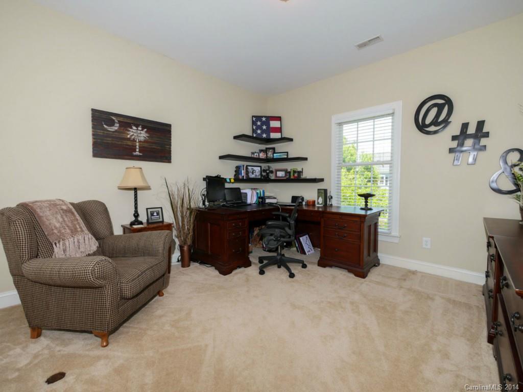 411 Bull Finch Bend Fort Mill, SC 29708 - Photo 17 of 22 a living room with furniture and a window