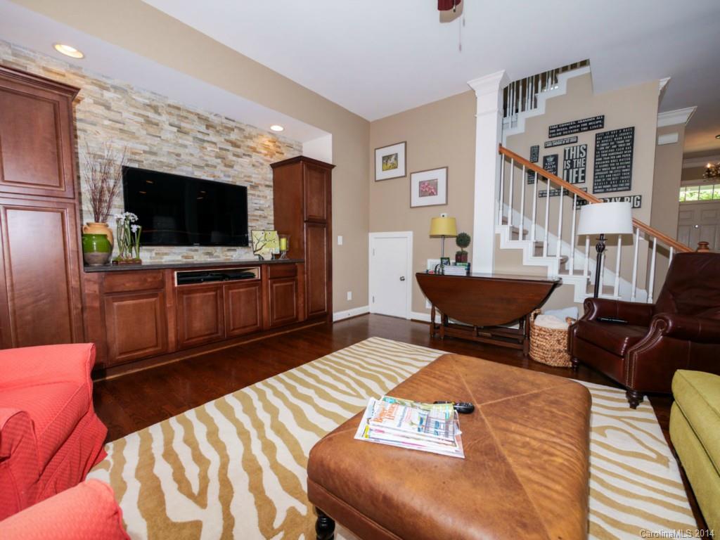 411 Bull Finch Bend Fort Mill, SC 29708 - Photo 4 of 22 a living room with furniture and a flat screen tv
