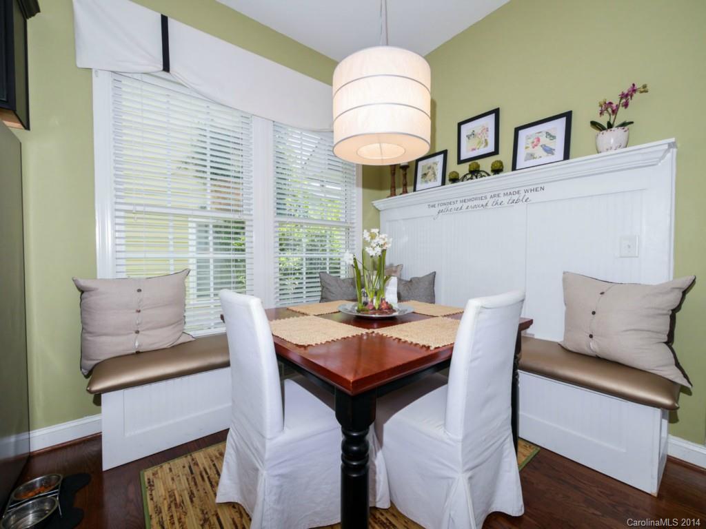 411 Bull Finch Bend Fort Mill, SC 29708 - Photo 7 of 22 a view of a dining room with furniture window and wooden floor