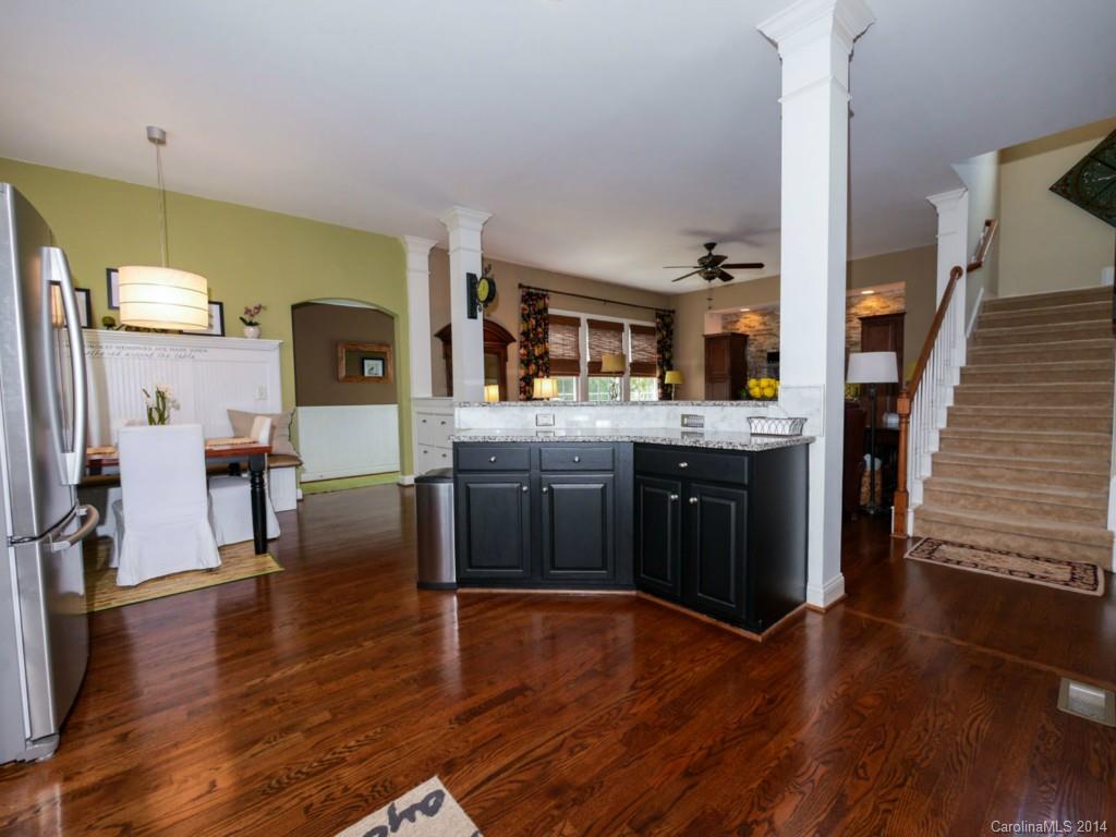411 Bull Finch Bend Fort Mill, SC 29708 - Photo 8 of 22 a kitchen with stainless steel appliances granite countertop a stove and a refrigerator