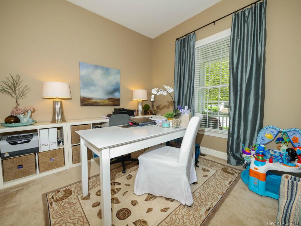 411 Bull Finch Bend Fort Mill, SC 29708 - Photo 10 of 22 a view of a dining room with furniture and a window