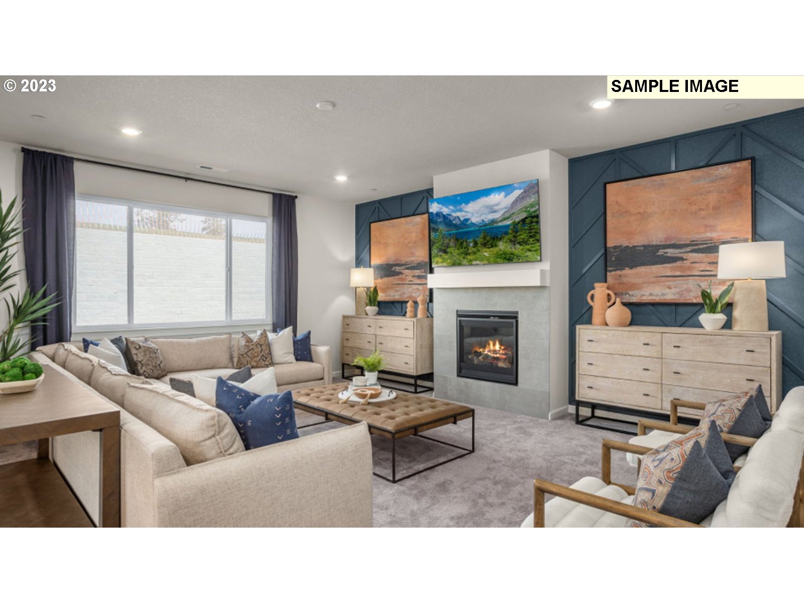 2720 South 6th Way Ridgefield, WA 98642 - Photo 3 of 9 a living room with furniture a fireplace and a flat screen tv