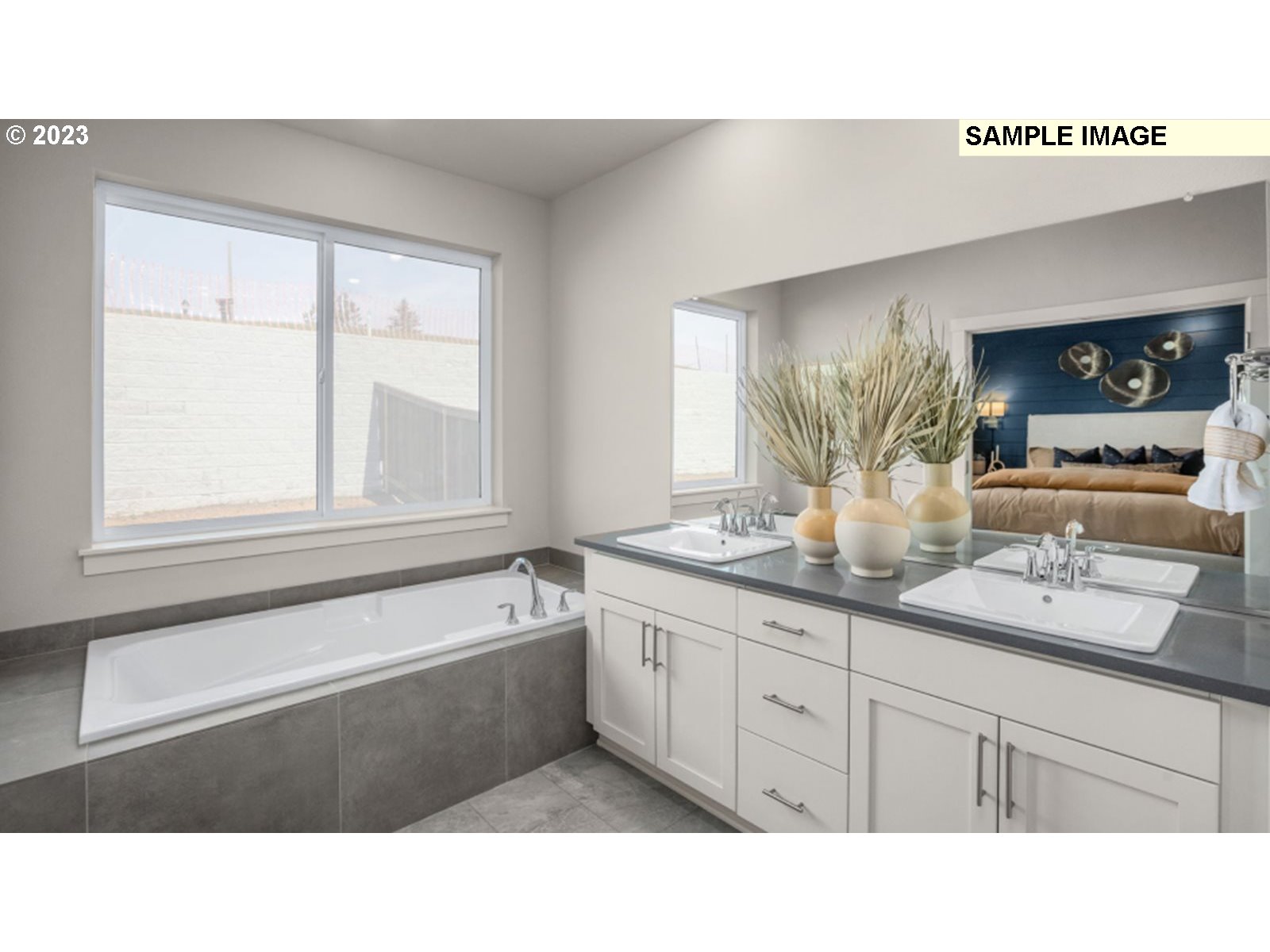 2720 South 6th Way Ridgefield, WA 98642 - Photo 7 of 9 a bathroom with a sink double vanity and a bathtub