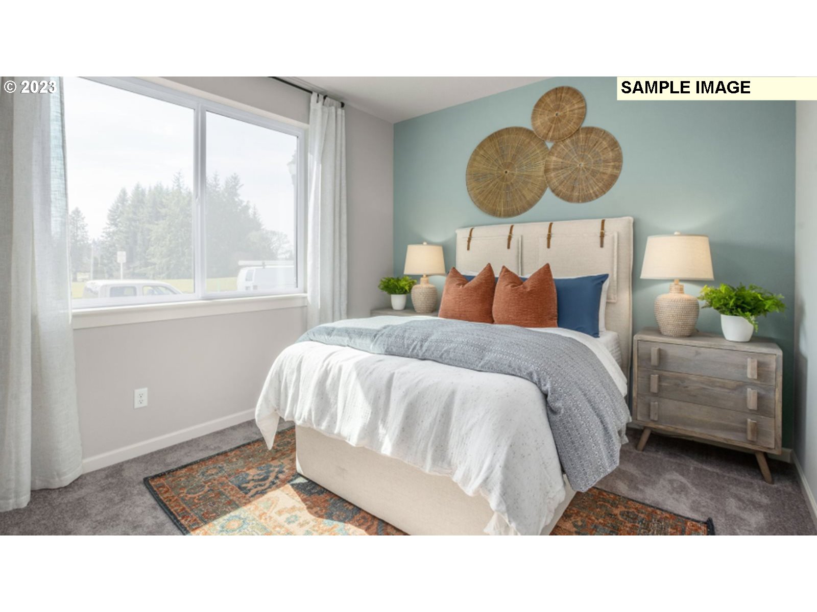 2720 South 6th Way Ridgefield, WA 98642 - Photo 9 of 9 a bedroom with a bed and a window