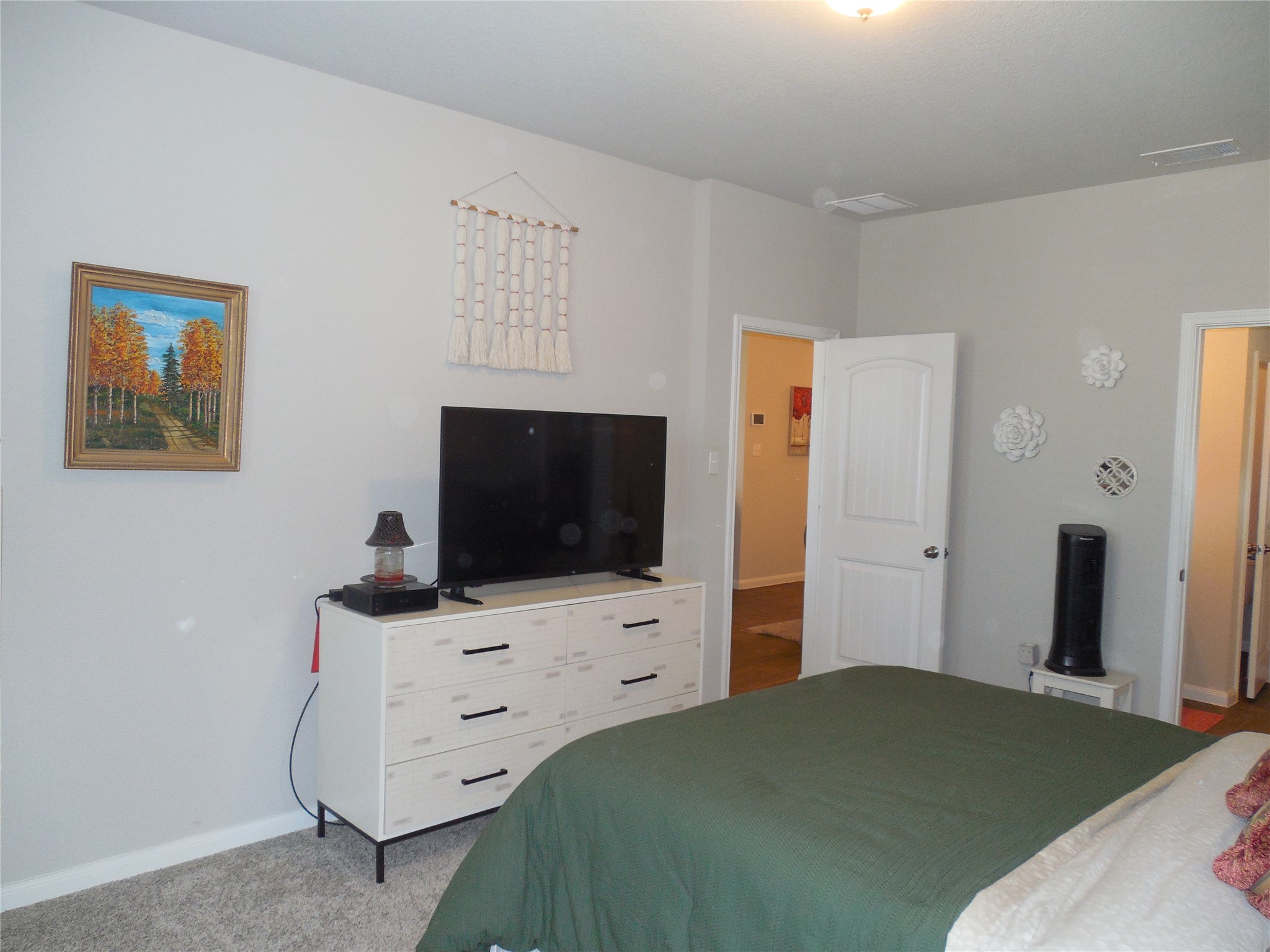 1009 Ferryman Drive Georgetown, TX 78626 - Photo 16 of 24 a bedroom with a bed and flat screen tv