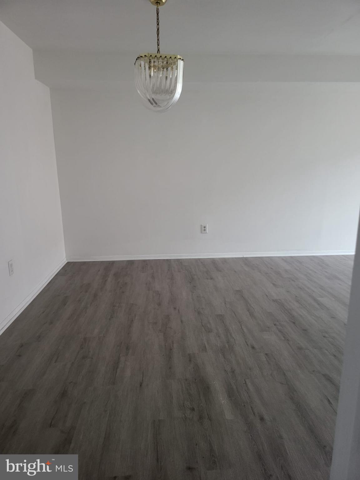 1129 Willinger Court Baltimore, MD 21202 - Photo 16 of 26 a view of room with wooden floor