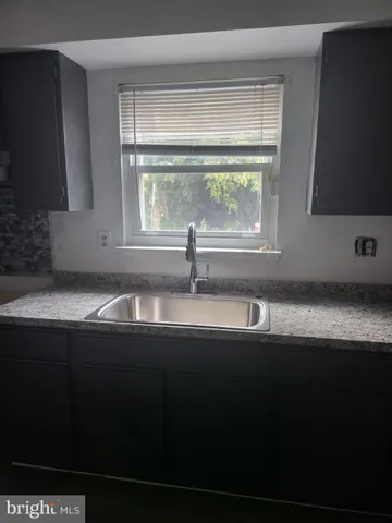 a sink sitting next to a window