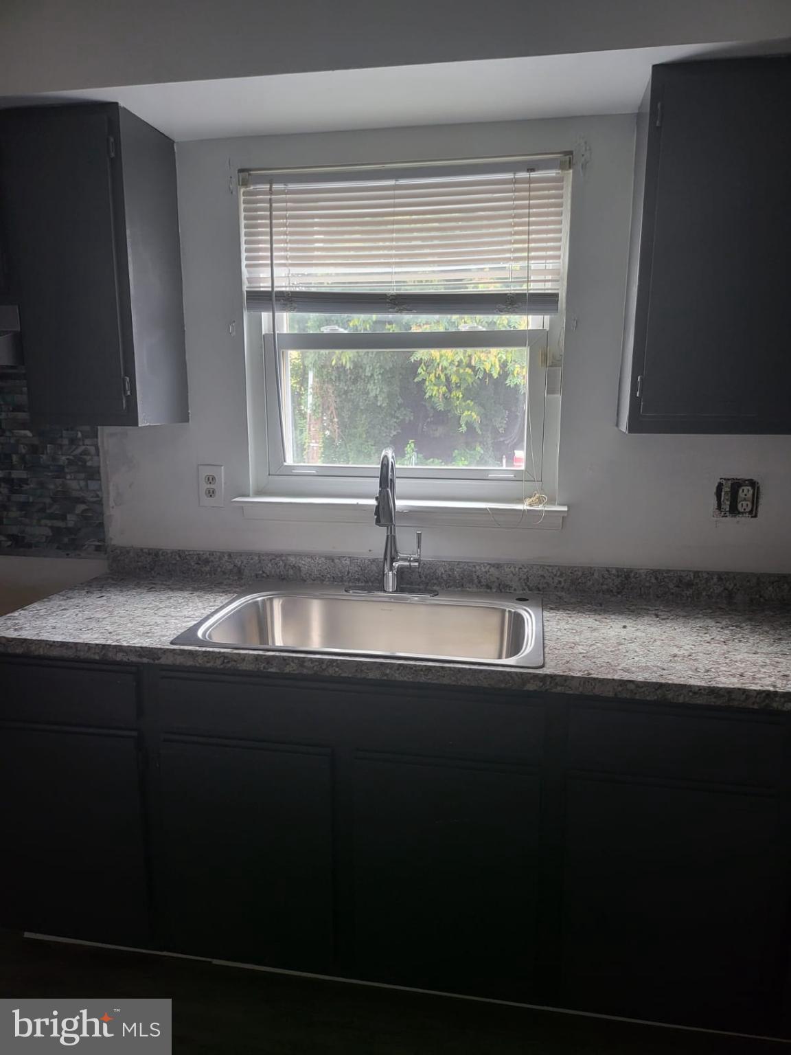 1129 Willinger Court Baltimore, MD 21202 - Photo 17 of 26 a sink sitting next to a window