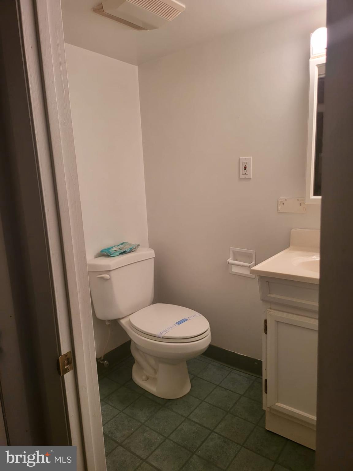 1129 Willinger Court Baltimore, MD 21202 - Photo 22 of 26 a white toilet sitting next to a sink