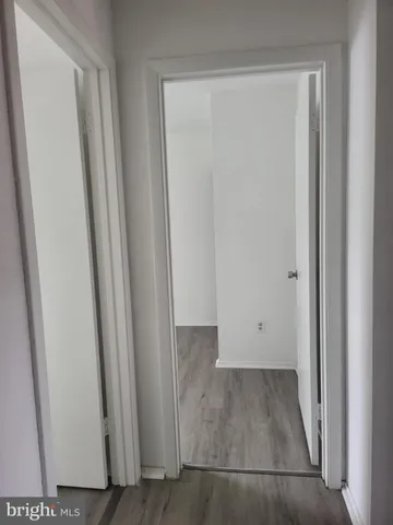 an empty room with wooden floor