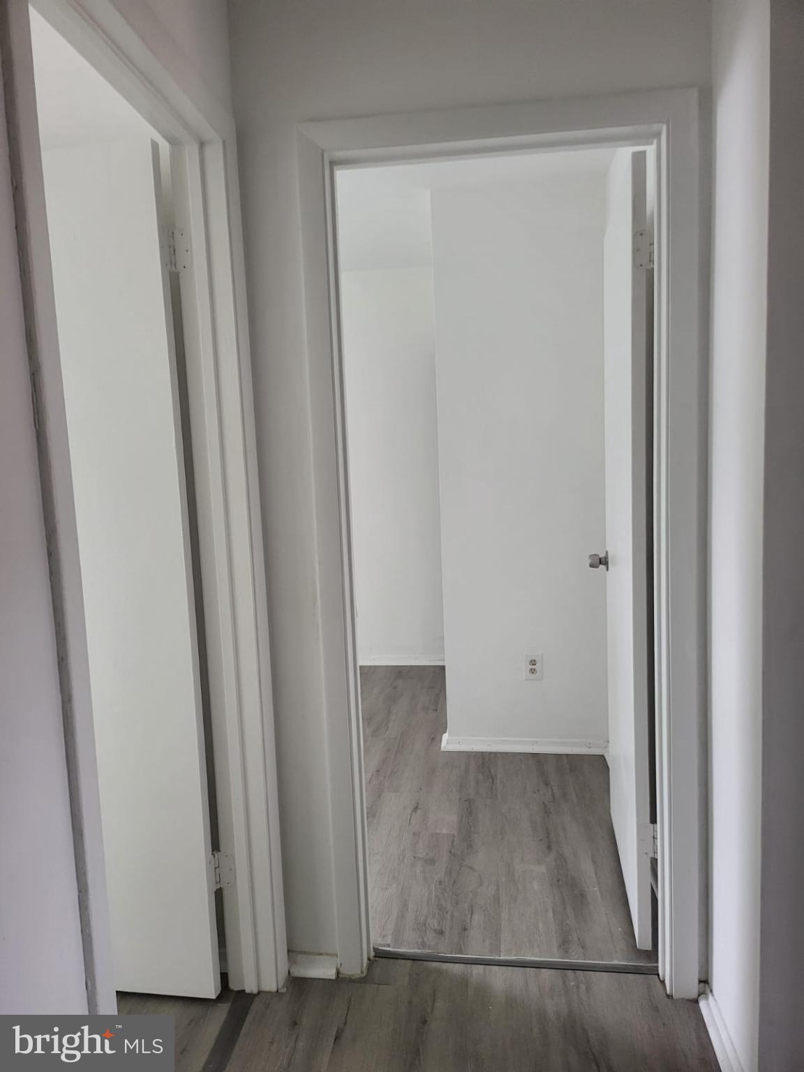 1129 Willinger Court Baltimore, MD 21202 - Photo 9 of 26 an empty room with wooden floor