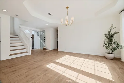 a kitchen with stainless steel appliances a sink a refrigerator a center island and a stove