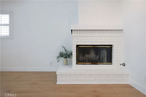 a bathroom with a granite countertop sink a toilet a mirror and shower