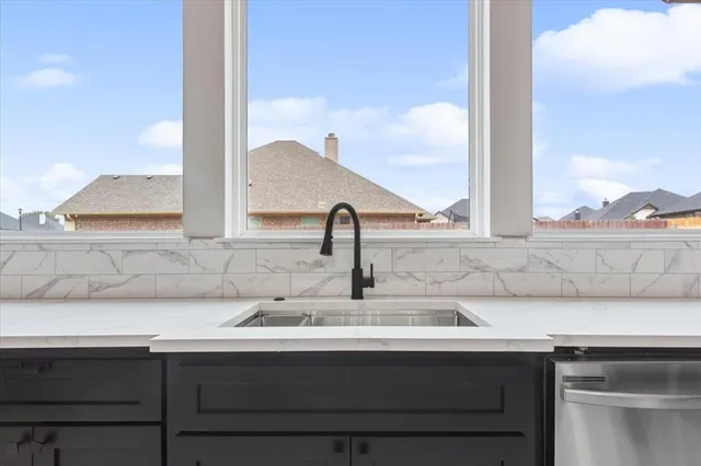 a view with a sink and a mirror