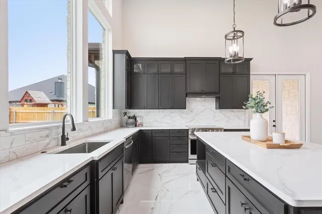 a kitchen with a sink and stove