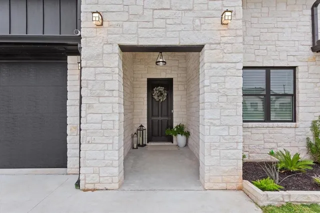 a front view of a house with outdoor space