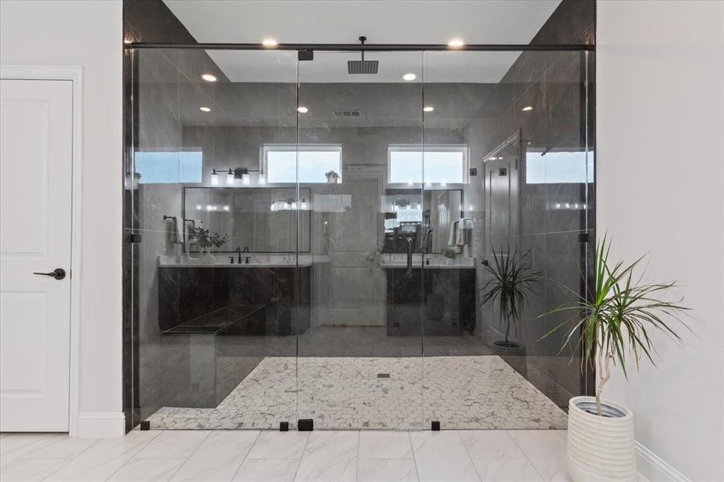 959 Gallant Fox Hewitt, TX 76643 - Photo 21 of 38 a bathroom with a glass shower door