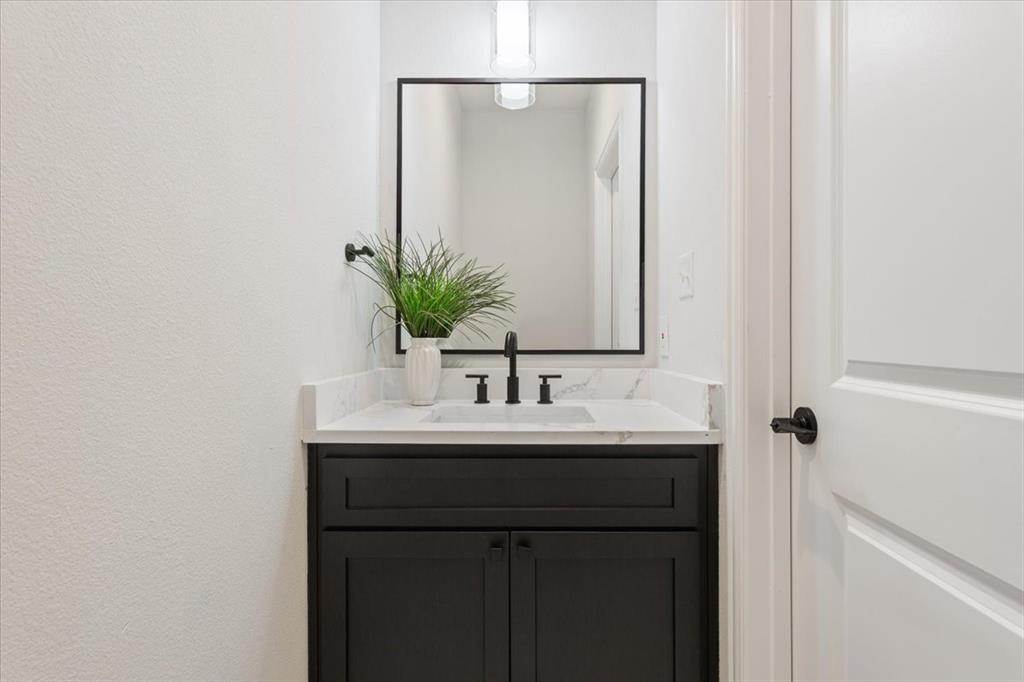 959 Gallant Fox Hewitt, TX 76643 - Photo 28 of 38 a bathroom with a sink and a mirror