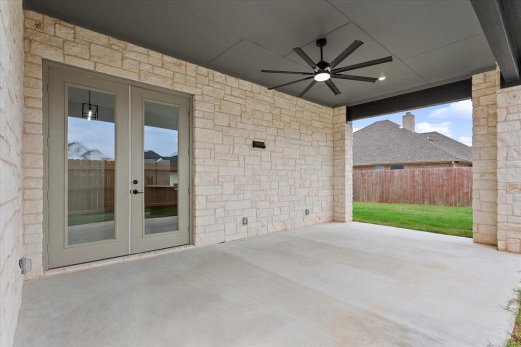 959 Gallant Fox Hewitt, TX 76643 - Photo 30 of 38 a view of an empty room with a fireplace and a window