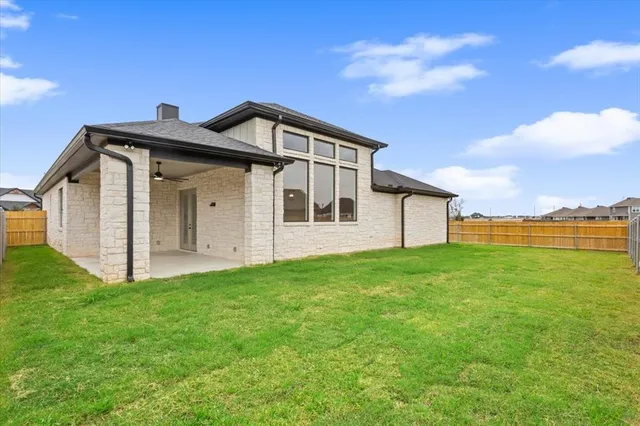 a view of a back yard of the house