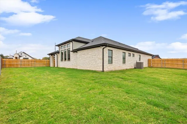 a view of a house with a big yard